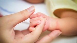 newborn-baby-hand-189680450